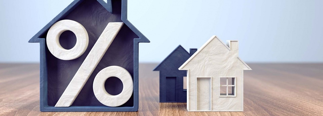 Houten huizen met een procentteken